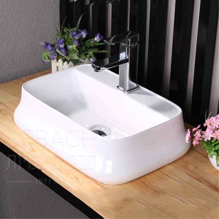 כיור חרס מונח אובלי דגם אפרת בגימור לבן, מידות 59x39x14 ס"מ, צורה מרווחת וזורמת